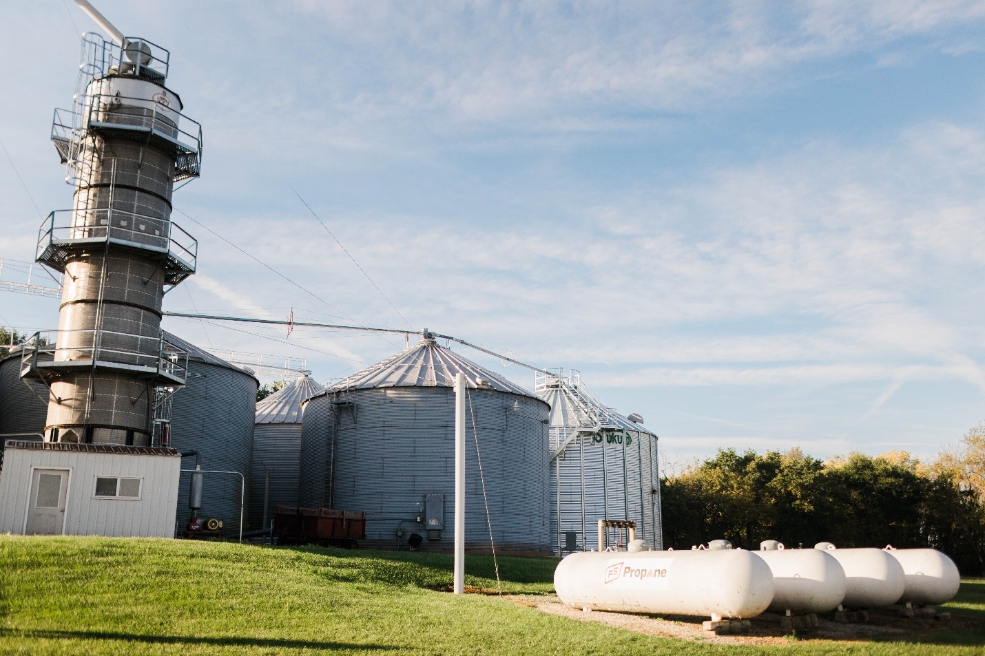 FS propane tanks in front of grain bins